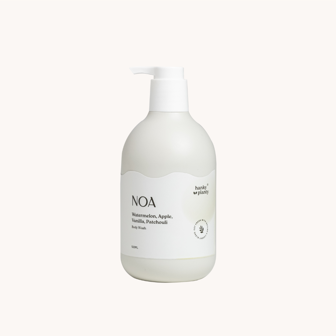 White bottle of NOA body wash on a white background