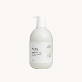 White bottle of NOA body wash on a white background