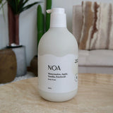 NOA Natural body wash, 500ml, with watermelon, apple, vanilla, and patchouli scent, in eco-friendly pump bottle by Hanky Planty, placed on a marble table.