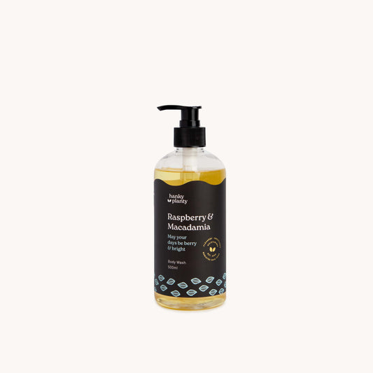 Hanky Planty Raspberry Macadamia Natural Body Wash, 500ml pump bottle with black label and golden-yellow liquid, displayed on a clean white background.