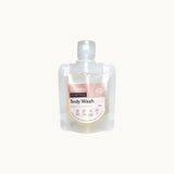 Hanky Planty Petite Antibacterial Body Wash, English Pear & Freesia scent, 30ml refill pouch with pink label, displayed on a white background.